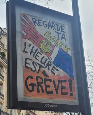 Demo in Paris gegen die Renten"reform" am 7. März 2023: Schaut auf Eure Rolex, die Stunde steht auf Streik (Foto Bernard Schmid)